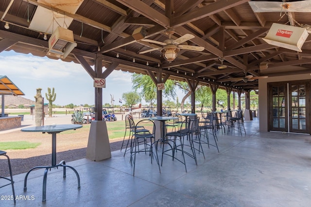 view of patio featuring a ceiling fan and a gazebo