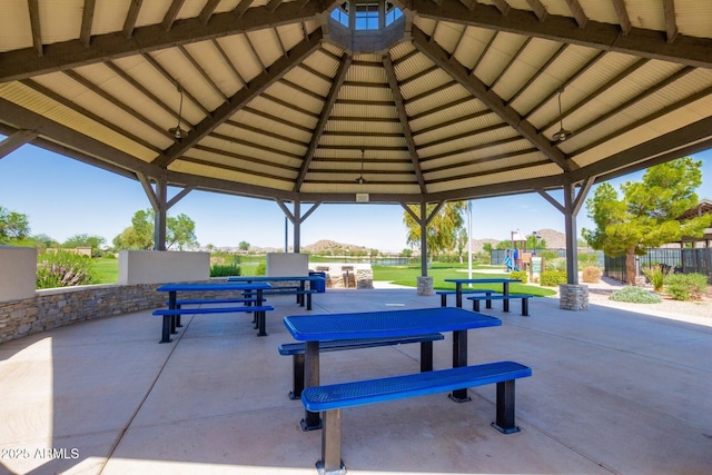 surrounding community featuring a patio area, fence, and a gazebo