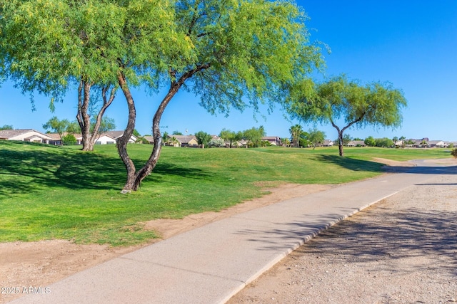 surrounding community with a yard