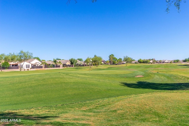 view of property's community featuring a lawn and golf course view