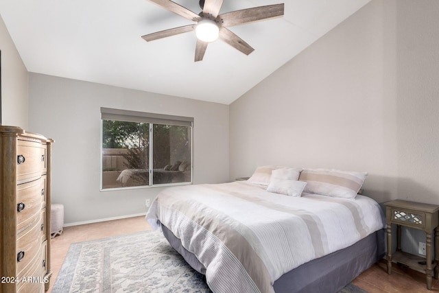 bedroom with ceiling fan and vaulted ceiling