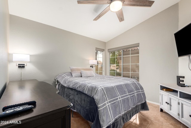 tiled bedroom featuring vaulted ceiling and ceiling fan