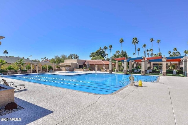 view of swimming pool featuring a patio area