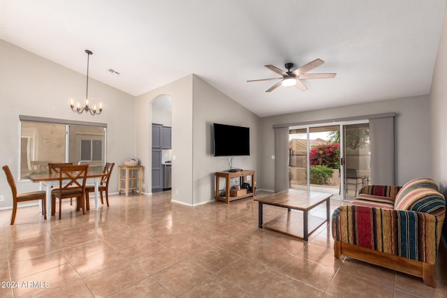 living room with light tile patterned floors, ceiling fan with notable chandelier, and high vaulted ceiling