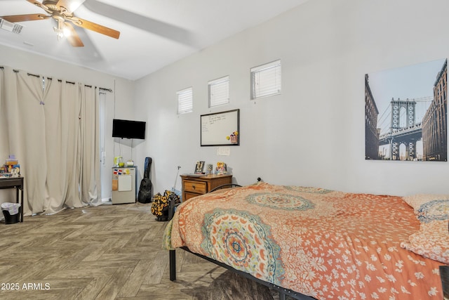 bedroom featuring parquet flooring and ceiling fan