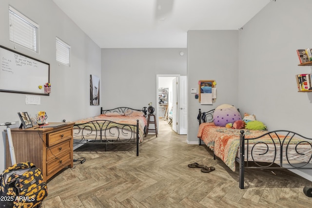 bedroom with light parquet flooring