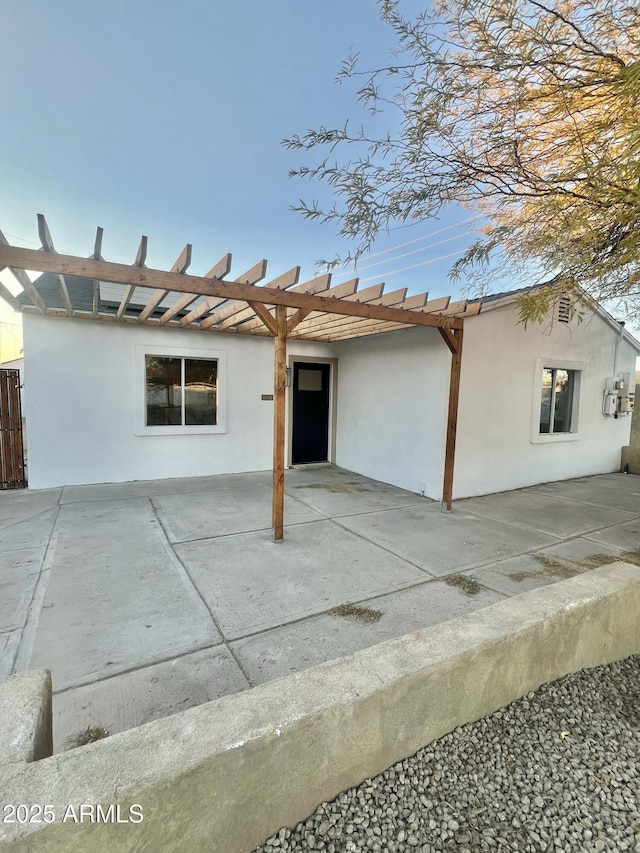 back of property with a patio area