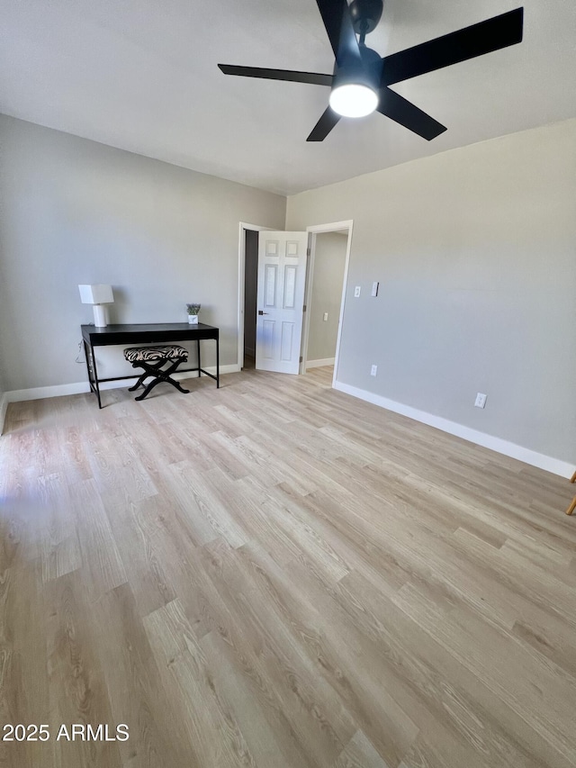 spare room with light hardwood / wood-style flooring and ceiling fan