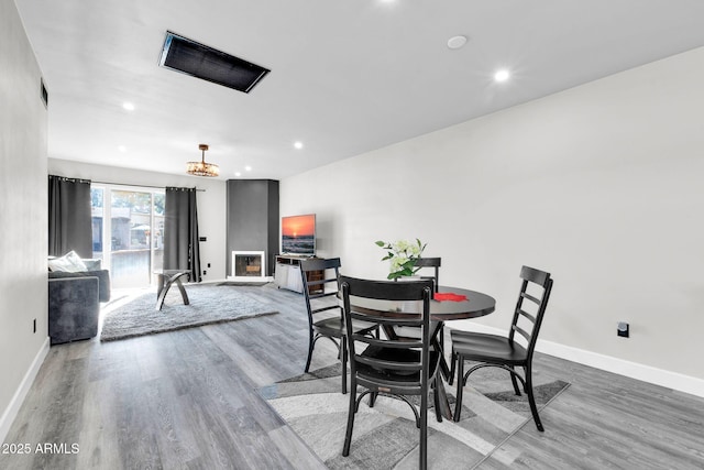 dining area with wood finished floors and baseboards