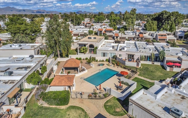 birds eye view of property featuring a mountain view