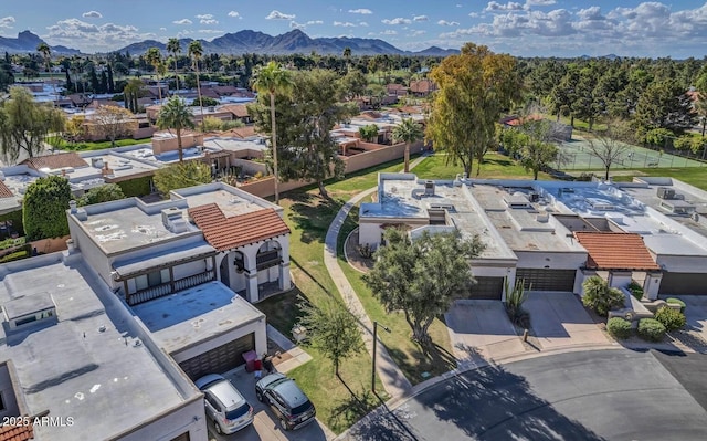 birds eye view of property with a mountain view