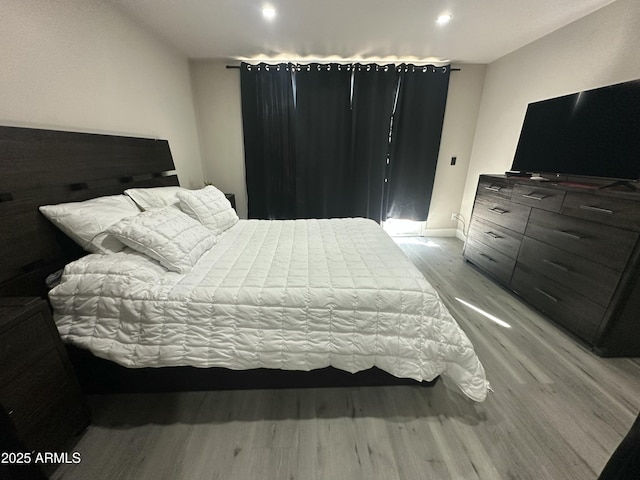 bedroom featuring recessed lighting and light wood-style floors