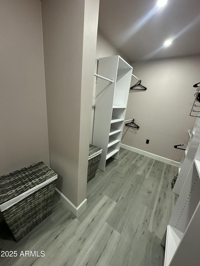 spacious closet featuring light wood finished floors