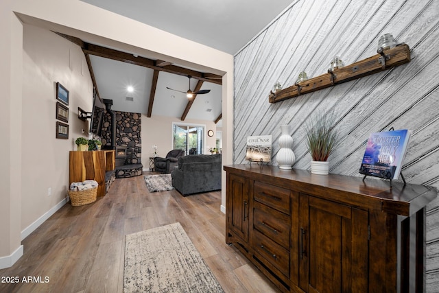 1500 W Pinetree Ct, Show Low, AZ 85901 - living room featuring ceiling fan, light wood-style flooring, and a wood stove