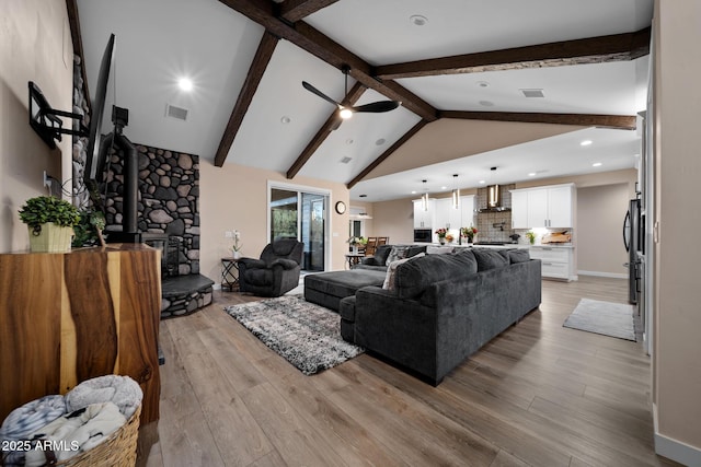 1500 W Pinetree Ct, Show Low, AZ 85901 - living area featuring a ceiling fan, light wood finished floors, a wood stove, and recessed lighting