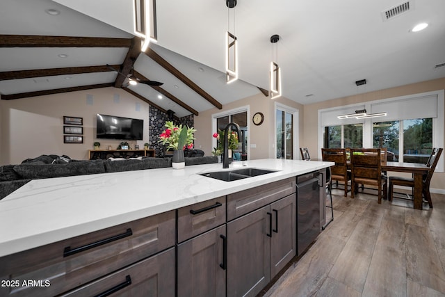 1500 W Pinetree Ct, Show Low, AZ 85901 - kitchen with open floor plan, stainless steel dishwasher, light wood-style flooring, pendant lighting, and recessed lighting