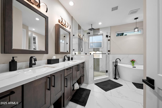1500 W Pinetree Ct, Show Low, AZ 85901 - bathroom with a stall shower, double vanity, a freestanding bath, recessed lighting, and marble finish flooring