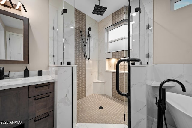 1500 W Pinetree Ct, Show Low, AZ 85901 - bathroom with a marble finish shower, vanity, a freestanding bath, and tile walls