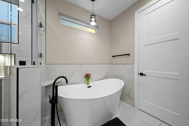 1500 W Pinetree Ct, Show Low, AZ 85901 - full bath featuring marble tiled floors, a freestanding tub, a marble finish shower, a wainscoted wall, and tile walls