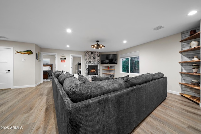 1500 W Pinetree Ct, Show Low, AZ 85901 - living area with light wood-style flooring, recessed lighting, and a fireplace