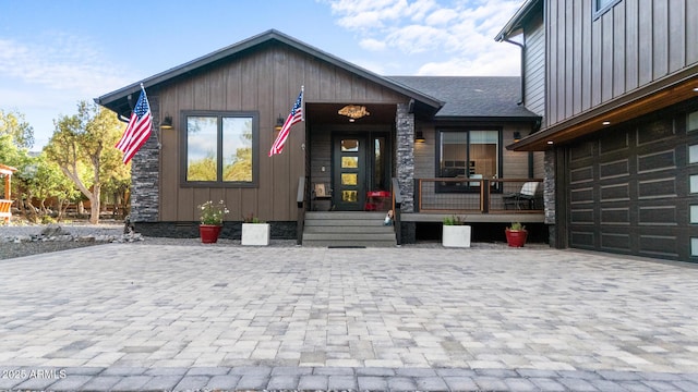 1500 W Pinetree Ct, Show Low, AZ 85901 - view of front of property featuring board and batten siding, decorative driveway, and covered porch