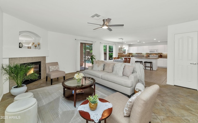 1821 E Patrick Ln, Phoenix, AZ 85024 - living room with ceiling fan, recessed lighting, and a fireplace