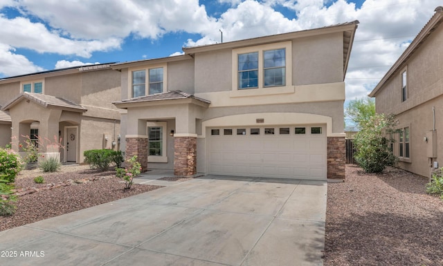 1821 E Patrick Ln, Phoenix, AZ 85024 - view of front facade featuring stone siding, stucco siding, driveway, and an attached garage