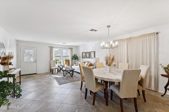 1821 E Patrick Ln, Phoenix, AZ 85024 - dining space with a chandelier, light tile patterned floors, and baseboards