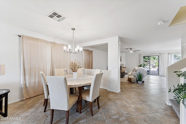 1821 E Patrick Ln, Phoenix, AZ 85024 - dining room with a chandelier, baseboards, ceiling fan, and light tile patterned flooring