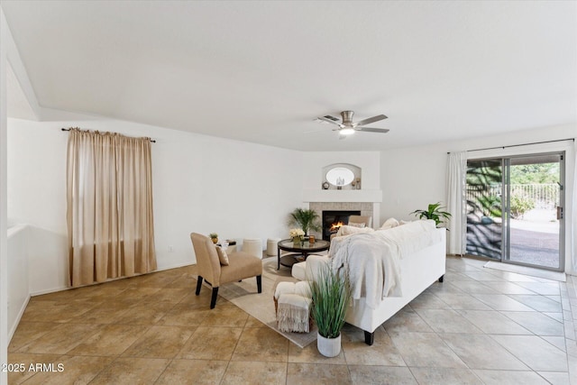 1821 E Patrick Ln, Phoenix, AZ 85024 - living area featuring ceiling fan, a fireplace, and light tile patterned floors