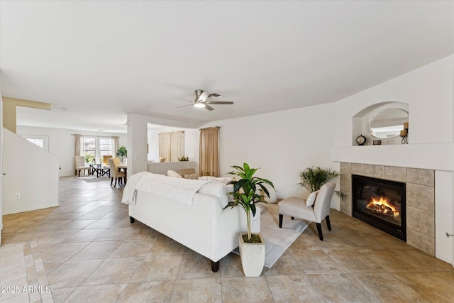 1821 E Patrick Ln, Phoenix, AZ 85024 - living room with a tiled fireplace, ceiling fan, and light tile patterned floors