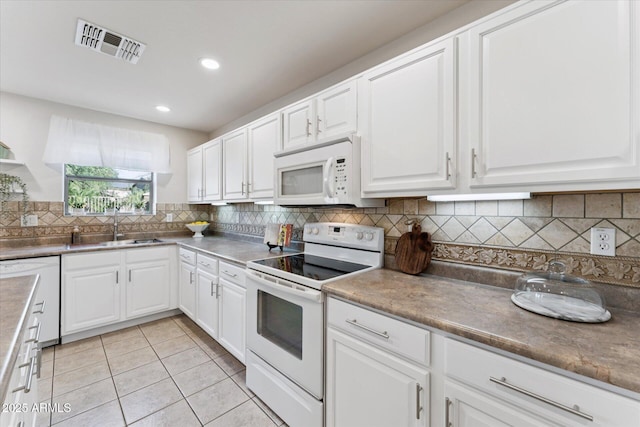 1821 E Patrick Ln, Phoenix, AZ 85024 - kitchen featuring white appliances, a sink, white cabinets, light tile patterned floors, and recessed lighting