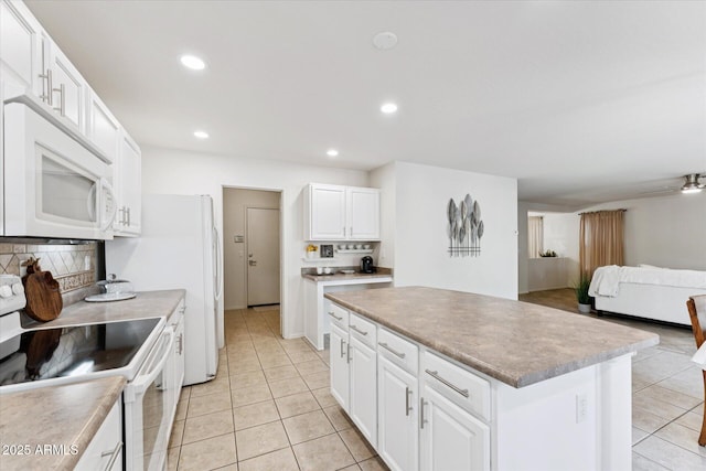 1821 E Patrick Ln, Phoenix, AZ 85024 - kitchen featuring white appliances, light tile patterned flooring, open floor plan, decorative backsplash, and recessed lighting