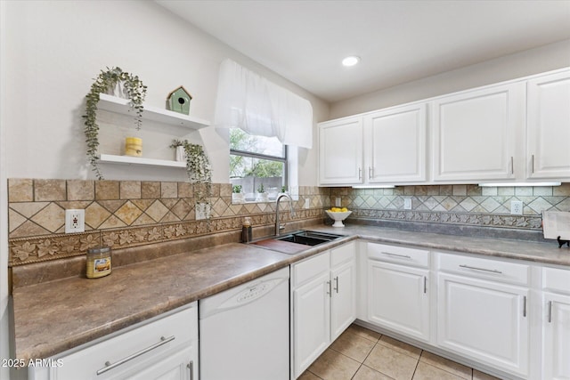 1821 E Patrick Ln, Phoenix, AZ 85024 - kitchen featuring dishwasher, a sink, tasteful backsplash, light tile patterned flooring, and white cabinetry