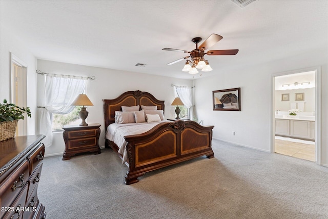 1821 E Patrick Ln, Phoenix, AZ 85024 - carpeted bedroom with ensuite bathroom, a ceiling fan, and baseboards