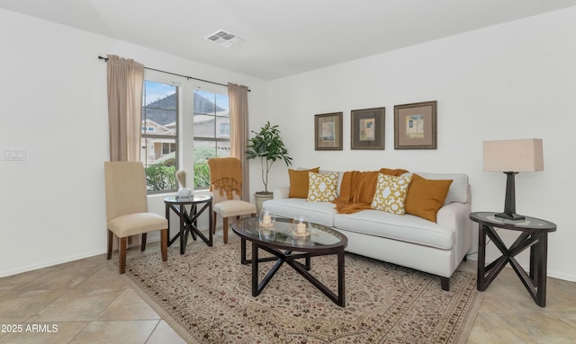 1821 E Patrick Ln, Phoenix, AZ 85024 - living area featuring baseboards and light tile patterned flooring