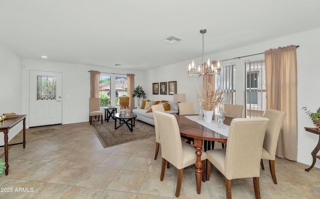 1821 E Patrick Ln, Phoenix, AZ 85024 - dining area with a chandelier, light tile patterned floors, and recessed lighting