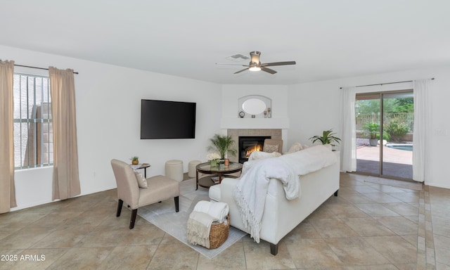 1821 E Patrick Ln, Phoenix, AZ 85024 - living room with a ceiling fan, a tile fireplace, and light tile patterned floors