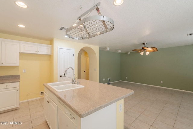 3665 E Thames Way, San Tan Valley, AZ 85140 - kitchen with a sink, white dishwasher, arched walkways, light tile patterned floors, and a ceiling fan