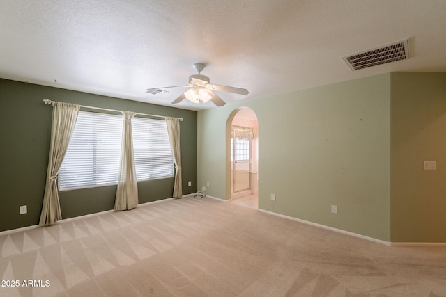 3665 E Thames Way, San Tan Valley, AZ 85140 - unfurnished room featuring arched walkways, light carpet, ceiling fan, and baseboards