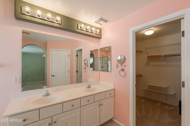 3665 E Thames Way, San Tan Valley, AZ 85140 - bathroom featuring double vanity and a spacious closet