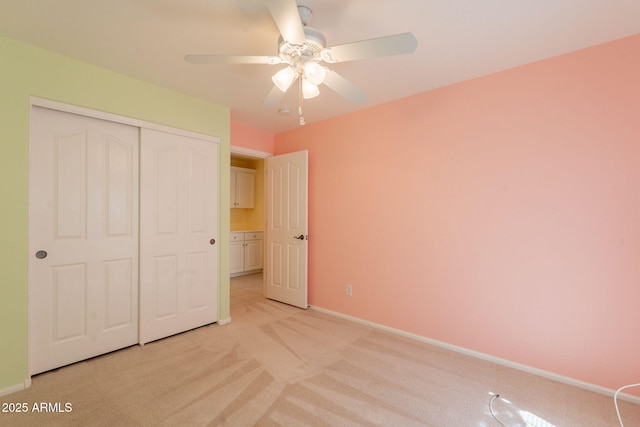 3665 E Thames Way, San Tan Valley, AZ 85140 - unfurnished bedroom with light carpet, a closet, baseboards, and ceiling fan