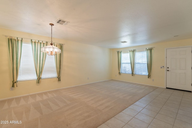 3665 E Thames Way, San Tan Valley, AZ 85140 - empty room featuring a chandelier, light carpet, baseboards, and light tile patterned flooring