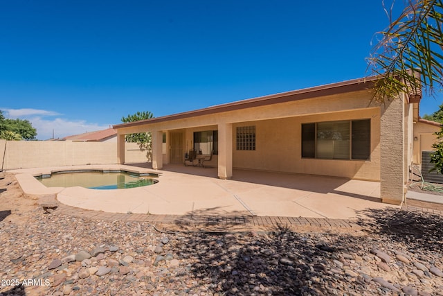 3665 E Thames Way, San Tan Valley, AZ 85140 - rear view of property with a fenced backyard, stucco siding, and a patio area