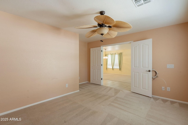 3665 E Thames Way, San Tan Valley, AZ 85140 - spare room featuring light carpet, ceiling fan, and baseboards