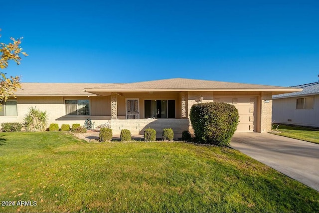 view of front facade featuring a garage and a front lawn