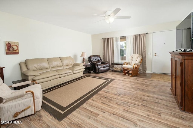 living room featuring light hardwood / wood-style floors and ceiling fan