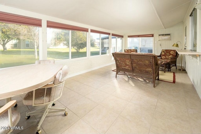 sunroom / solarium featuring vaulted ceiling