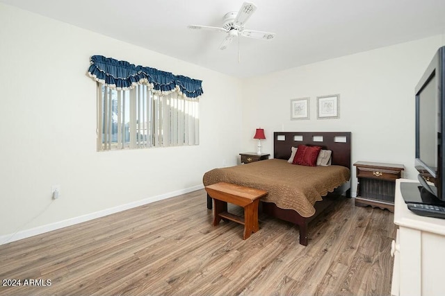 bedroom featuring light wood-type flooring and ceiling fan