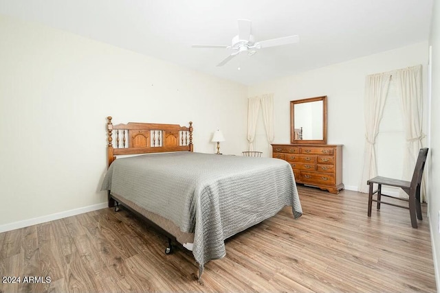 bedroom with ceiling fan and light wood-type flooring